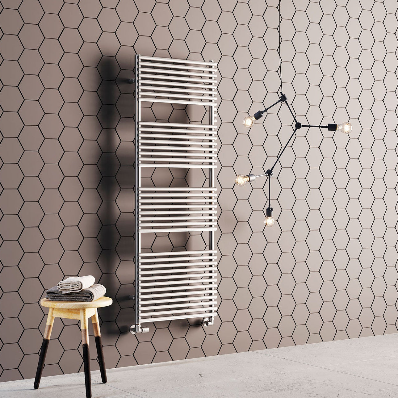 A modern bathroom featuring a stainless steel radiator