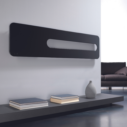 Modern living room with a black wall-mounted radiator and a gray sofa.