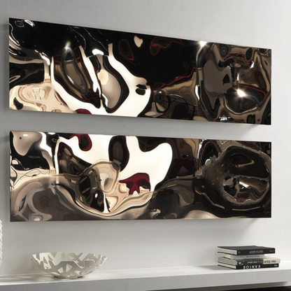 A Cordivari Blow modern designed horizontal hot water radiator made of polished stainless steel, featuring abstract reflections of light.