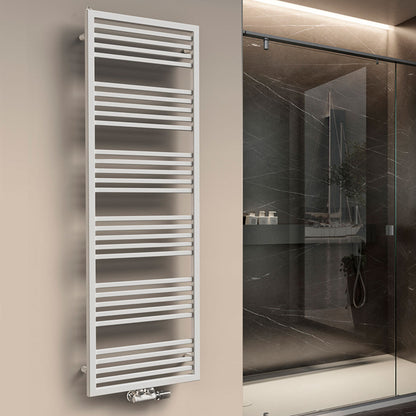 A vertical hydronic towel warmer with a sleek white design, mounted on a wall in a modern bathroom setting.