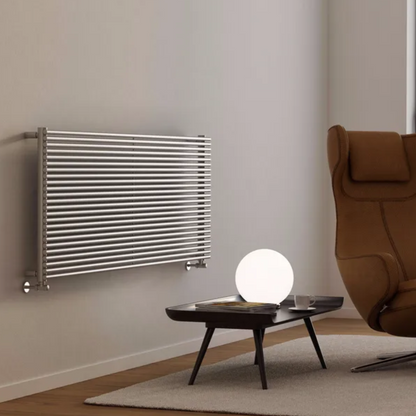 Modern room with a Stainless Steel radiator on the wall and a brown armchair.