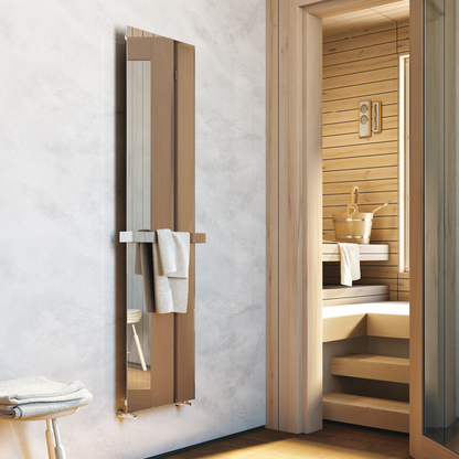 A vertical hot water radiator made of stainless steel with a minimalist design, mounted in a bathroom setting, featuring a towel bar on the side.