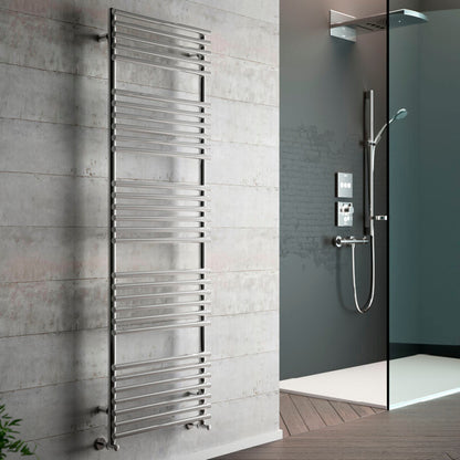 Towel radiator mounted on a tiled wall next to a shower setup.